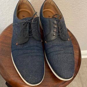 Gently used Aldo men’s shoes. Dark navy blue with white soles and black back